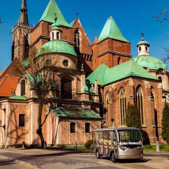 Cathedral in Wroclaw and electric car (melex)