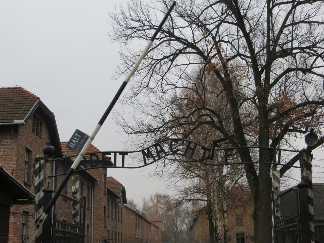board with the inscription arbeit macht frei in Auschwitz-Birkenau Museum