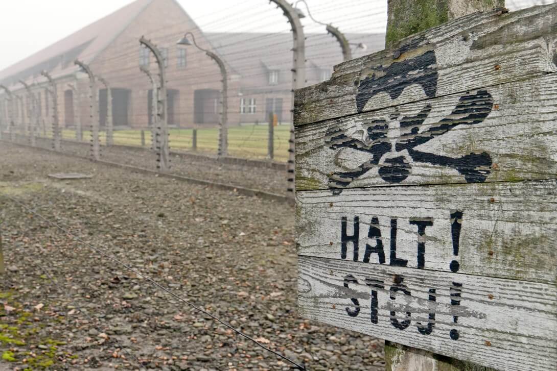 board with the inscription halt in Auschwitz-Birkenau Museum