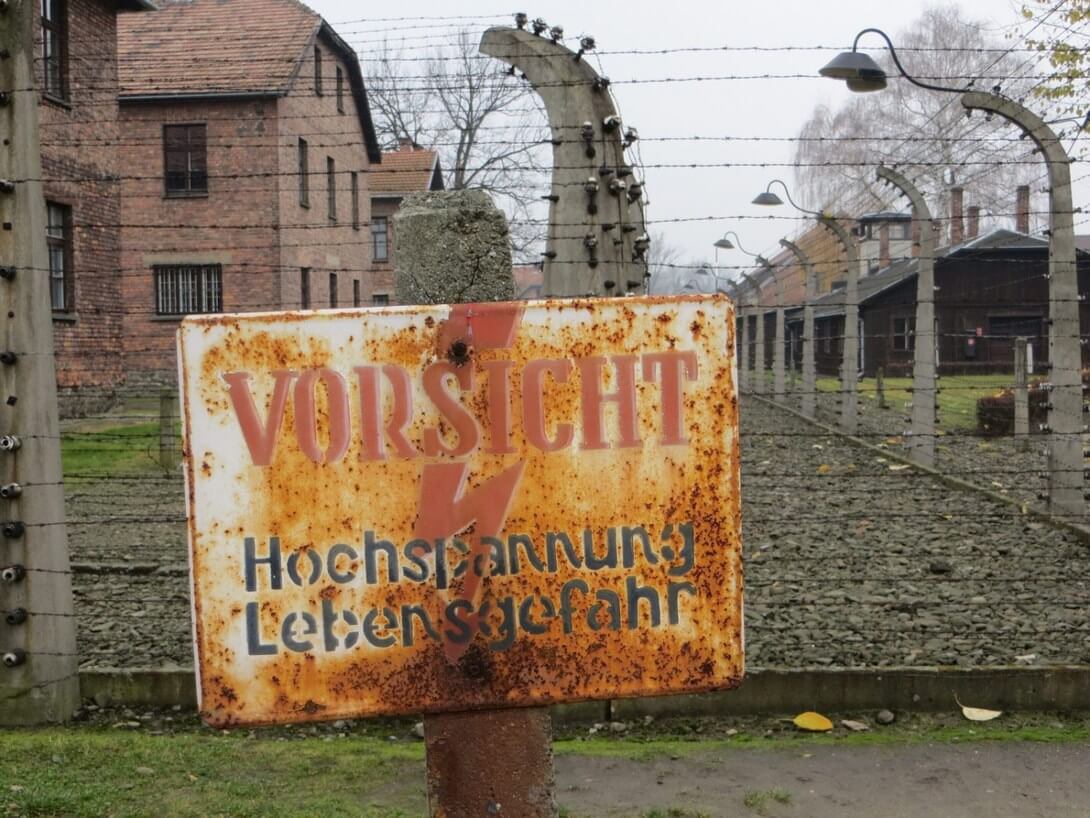 warning sign in Auschwitz-Birkenau Museum
